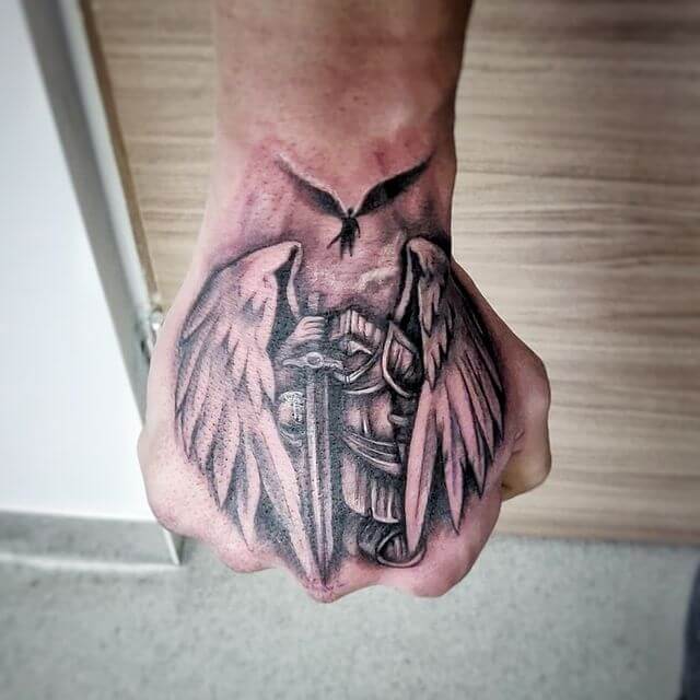 Guardian angle fist tattoo