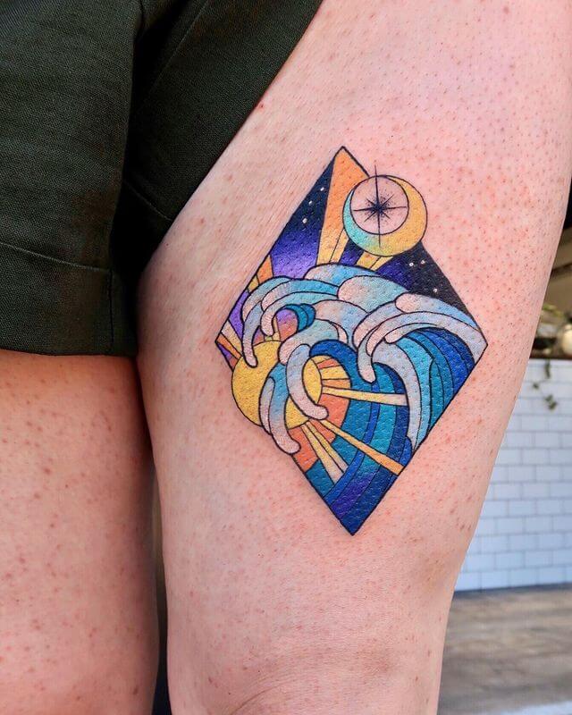 Wave Tattoo On Woman thigh