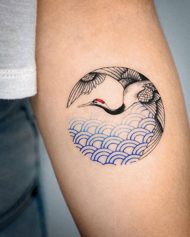 crane and oriental wave tattoo