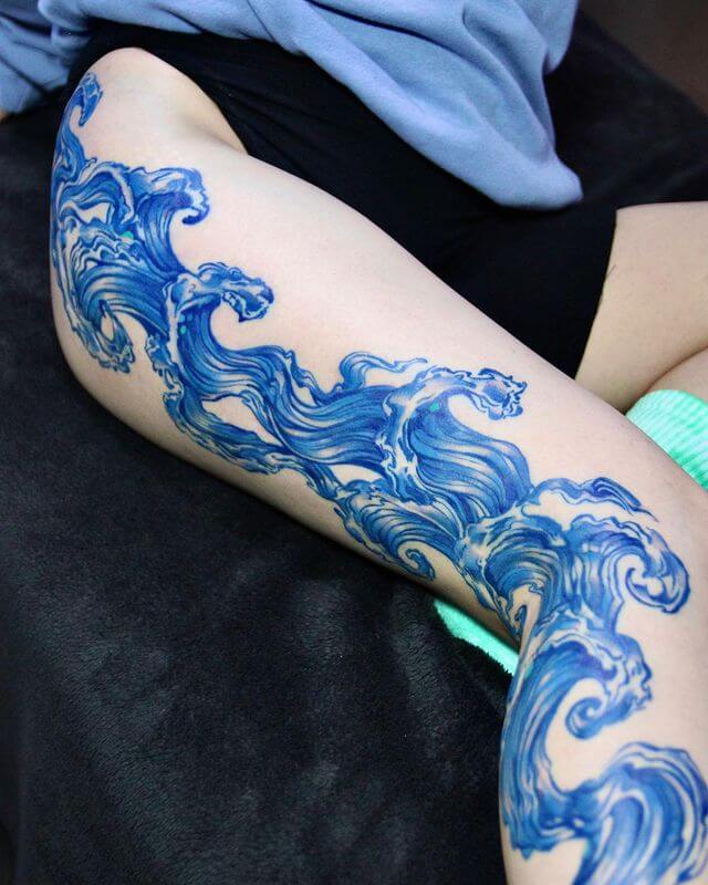 long wave hip to leg tattoo