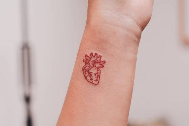 Red heart tattoo
