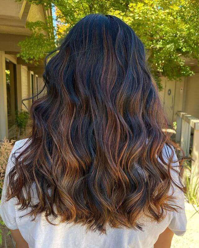 warm brown balayage on black hair