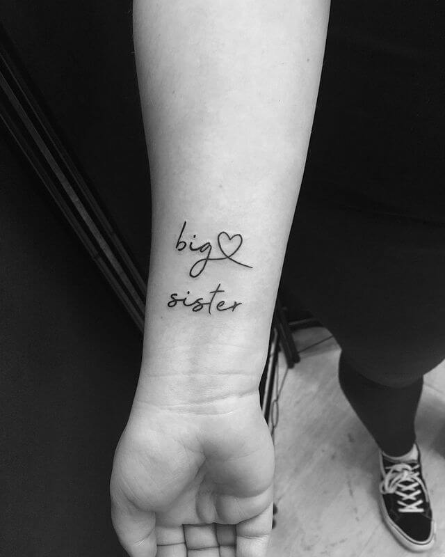 wording with small heart tattoo