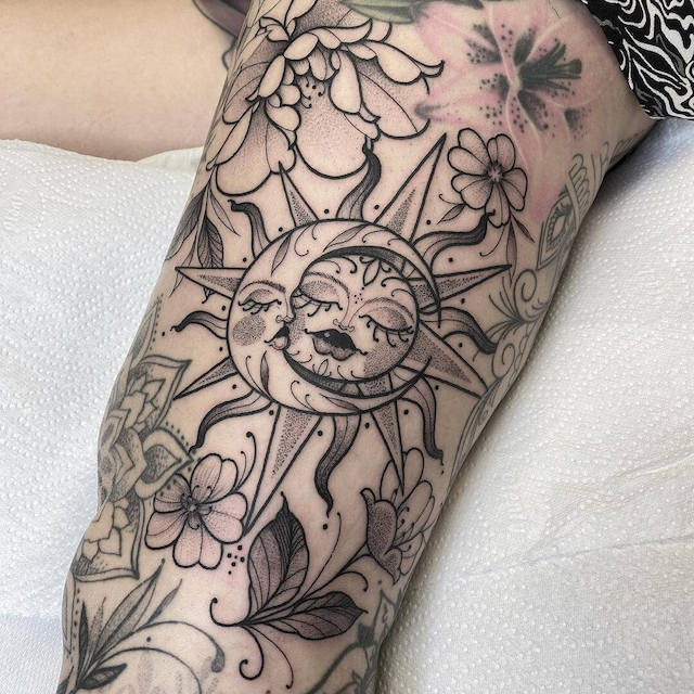 sun and moon thigh tattoo