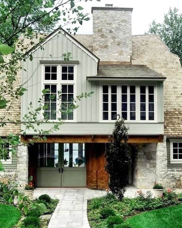 sage green house and brown roof