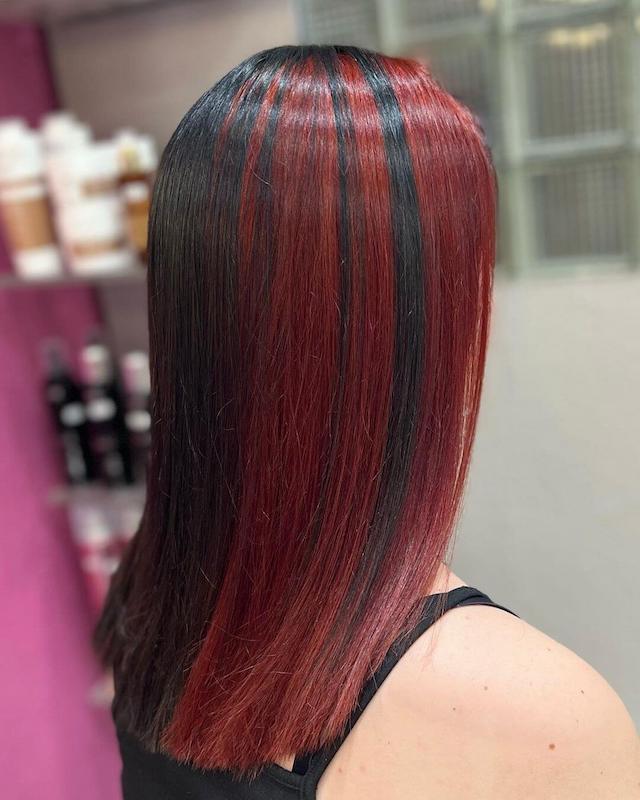 Black Hair with Red Skunk Stripe