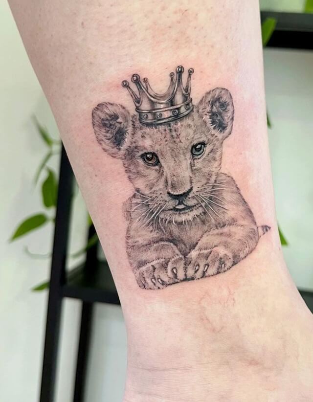 lion with a crown tattoo