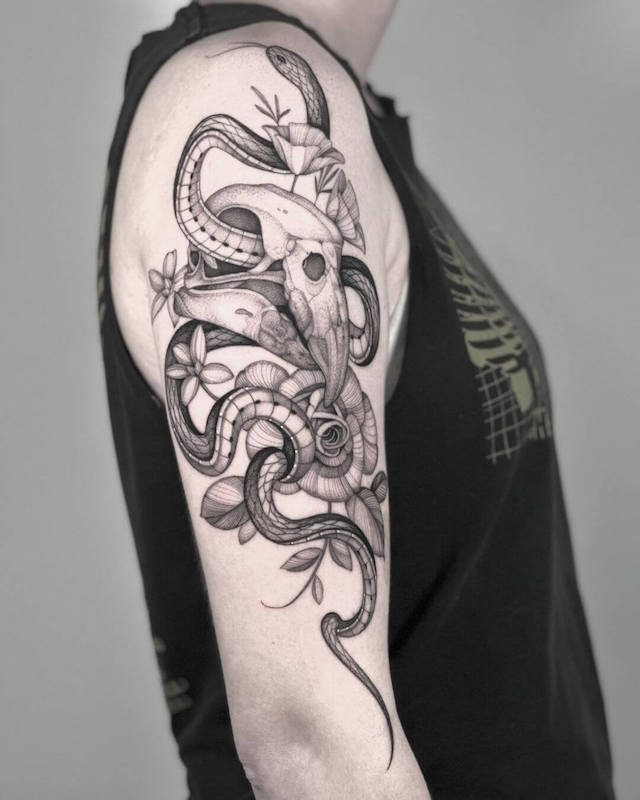 Macaw skull, snake & flowers tattoo