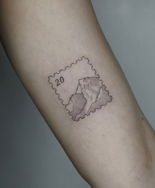 mountain stamp tattoo